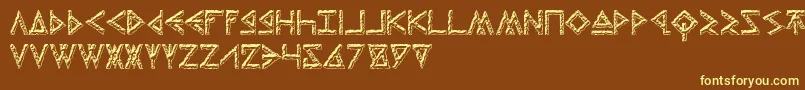 ThorsHammerCarved-fontti – keltaiset fontit ruskealla taustalla