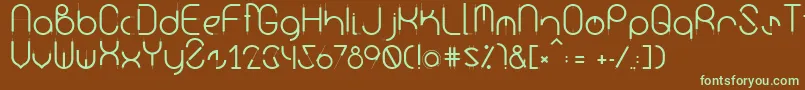 フォントKurba – 緑色の文字が茶色の背景にあります。