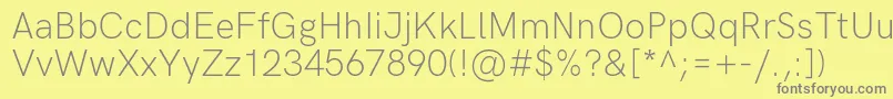 HkgroteskLight-Schriftart – Graue Schriften auf gelbem Hintergrund