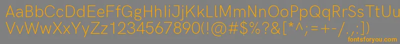 HkgroteskLight-Schriftart – Orangefarbene Schriften auf grauem Hintergrund