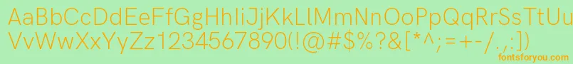 HkgroteskLight-Schriftart – Orangefarbene Schriften auf grünem Hintergrund