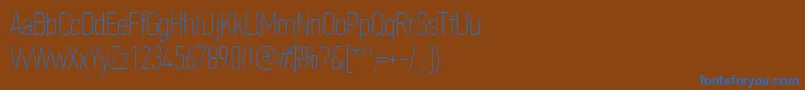 Fonte PfdintextcompproXthin – fontes azuis em um fundo marrom