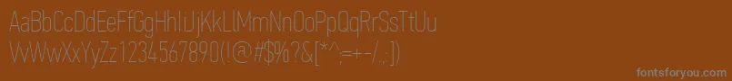 Czcionka PfdintextcompproXthin – szare czcionki na brązowym tle
