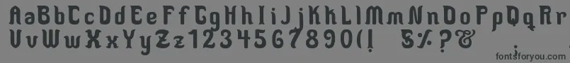 フォントMedusaScript – 黒い文字の灰色の背景