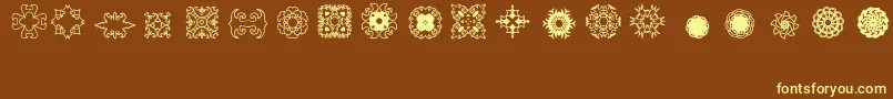 Ladoodles2-fontti – keltaiset fontit ruskealla taustalla