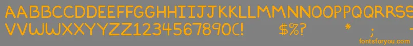 フォントDilbertfont2 – オレンジの文字は灰色の背景にあります。