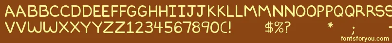Dilbertfont2-fontti – keltaiset fontit ruskealla taustalla
