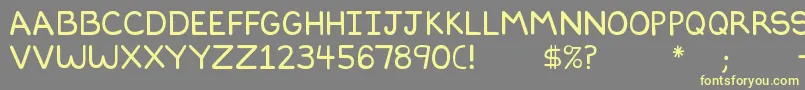 Dilbertfont2-fontti – keltaiset fontit harmaalla taustalla