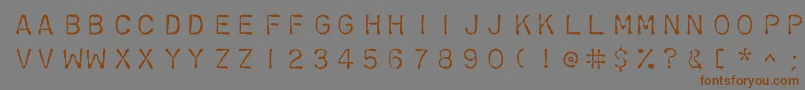 フォントChromosomelight – 茶色の文字が灰色の背景にあります。