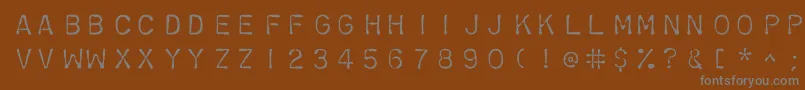 Chromosomelight-fontti – harmaat kirjasimet ruskealla taustalla