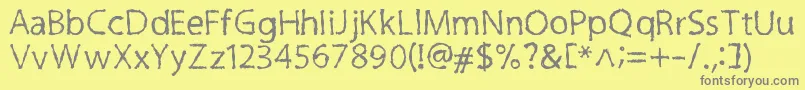 フォントInkyCre – 黄色の背景に灰色の文字