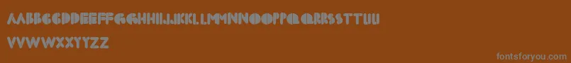 Czcionka Boldfacestencil – szare czcionki na brązowym tle