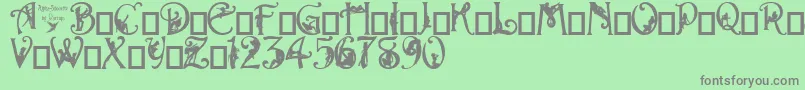 フォントAlphaSilouette – 緑の背景に灰色の文字