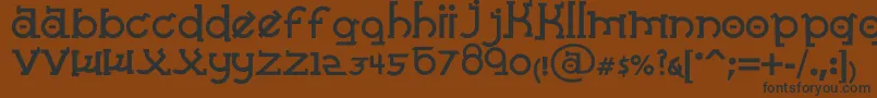 フォントAlmostSanskritTaj – 黒い文字が茶色の背景にあります