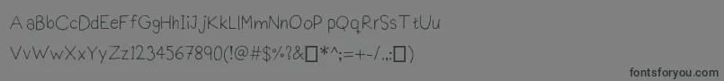 フォントPraktiscript – 黒い文字の灰色の背景