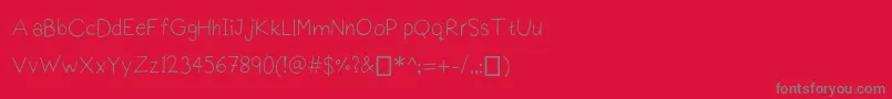 Czcionka Praktiscript – szare czcionki na czerwonym tle