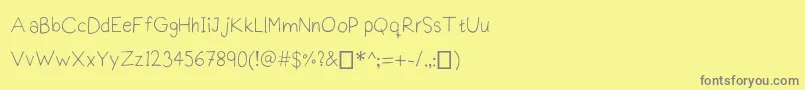 Praktiscript Font – Gray Fonts on Yellow Background