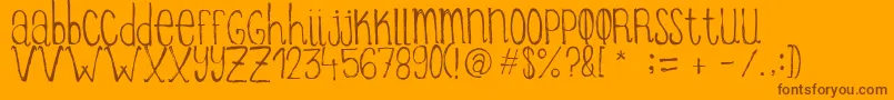 ItziargobigRegular-Schriftart – Braune Schriften auf orangefarbenem Hintergrund