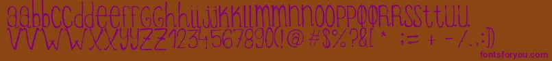 ItziargobigRegular Font – Purple Fonts on Brown Background