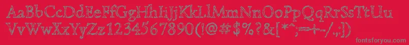 フォントLazurskiengravedc – 赤い背景に灰色の文字