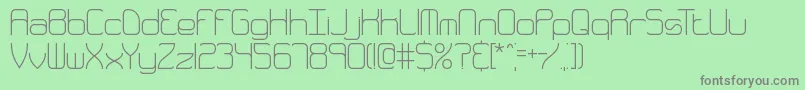 QuarterlyThinBrk-Schriftart – Graue Schriften auf grünem Hintergrund