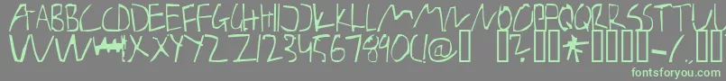 Weitere Informationen zur BarelyManilow-Schriftart BarelyManilow-Schriftart – Grüne Schriften auf grauem Hintergrund