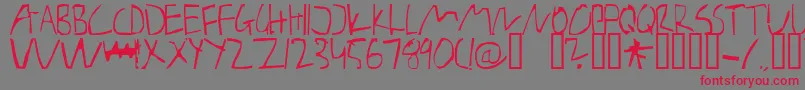 BarelyManilow Font – Red Fonts on Gray Background