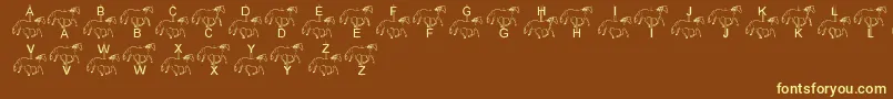 LmsMerryGoRound-fontti – keltaiset fontit ruskealla taustalla