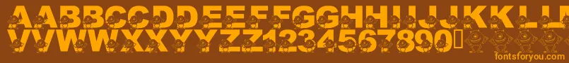 Czcionka LmsGooglyBear – pomarańczowe czcionki na brązowym tle