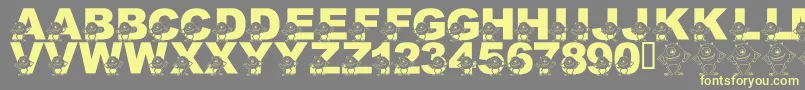 LmsGooglyBear-Schriftart – Gelbe Schriften auf grauem Hintergrund