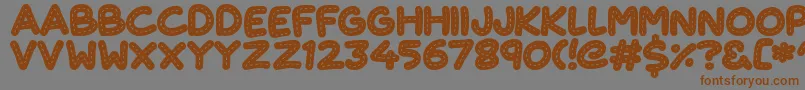 More about CuteStitch Font CuteStitch Font – Brown Fonts on Gray Background
