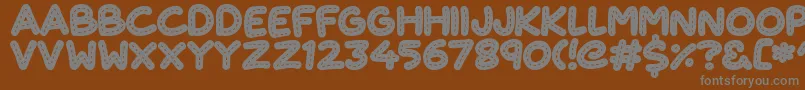 フォントCuteStitch – 茶色の背景に灰色の文字