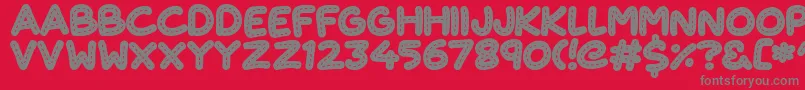 Fonte CuteStitch – fontes cinzas em um fundo vermelho