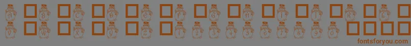 フォントPf Snowman3 – 茶色の文字が灰色の背景にあります。