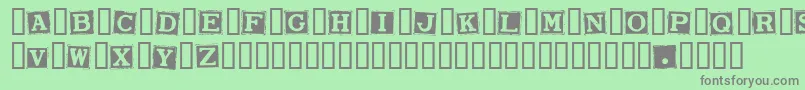 SmarganaWakes-Schriftart – Graue Schriften auf grünem Hintergrund