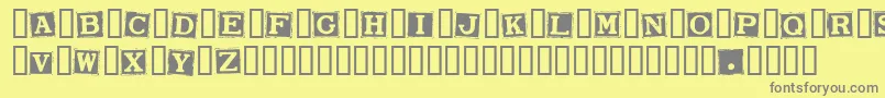 SmarganaWakes-Schriftart – Graue Schriften auf gelbem Hintergrund