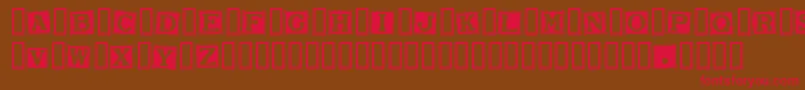 SmarganaWakes-Schriftart – Rote Schriften auf braunem Hintergrund