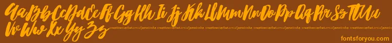 Hubster Font – Orange Fonts on Brown Background