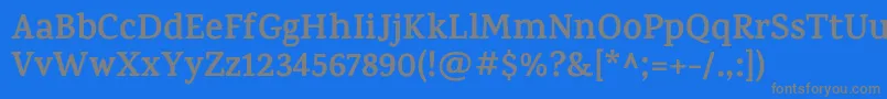 KarmaBold-Schriftart – Graue Schriften auf blauem Hintergrund
