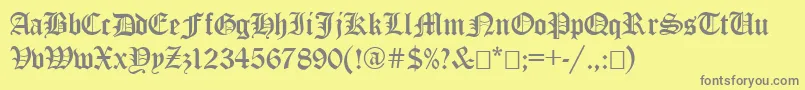 EncientGermanGothic-fontti – harmaat kirjasimet keltaisella taustalla
