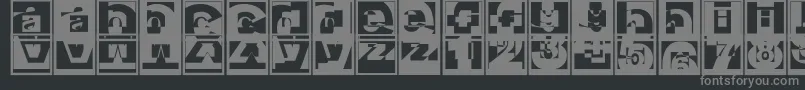 Brokensanscaps-fontti – harmaat kirjasimet mustalla taustalla