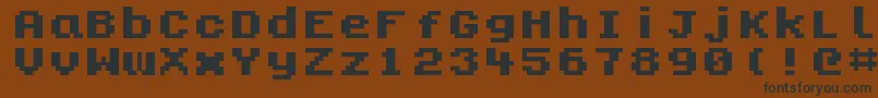 フォントKongtext – 黒い文字が茶色の背景にあります