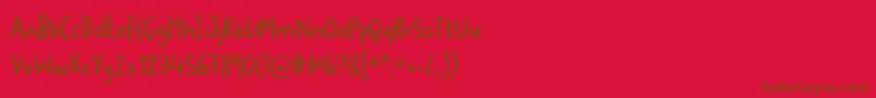 Ugiftigdemo-Schriftart – Braune Schriften auf rotem Hintergrund