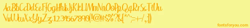 フォントWakingup – オレンジの文字が黄色の背景にあります。