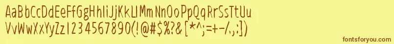 フォントViidenPenninOperetti – 茶色の文字が黄色の背景にあります。