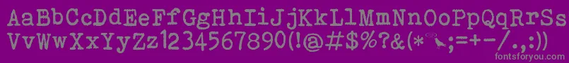 BohemianTypewriter-fontti – harmaat kirjasimet violetilla taustalla