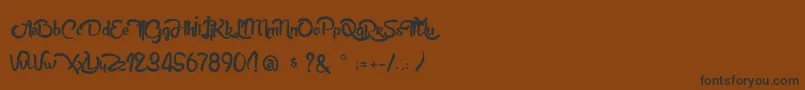 AnabelleScriptLight Font – Black Fonts on Brown Background