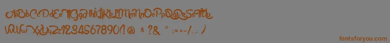 フォントAnabelleScriptLight – 茶色の文字が灰色の背景にあります。