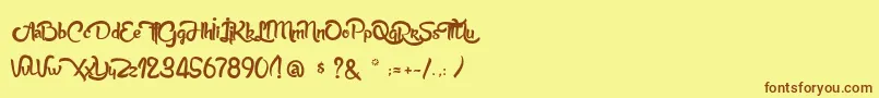 AnabelleScriptLight-Schriftart – Braune Schriften auf gelbem Hintergrund