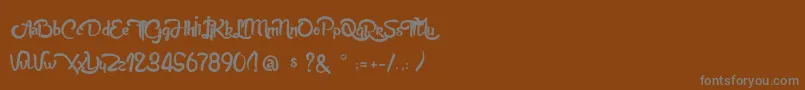 AnabelleScriptLight-Schriftart – Graue Schriften auf braunem Hintergrund